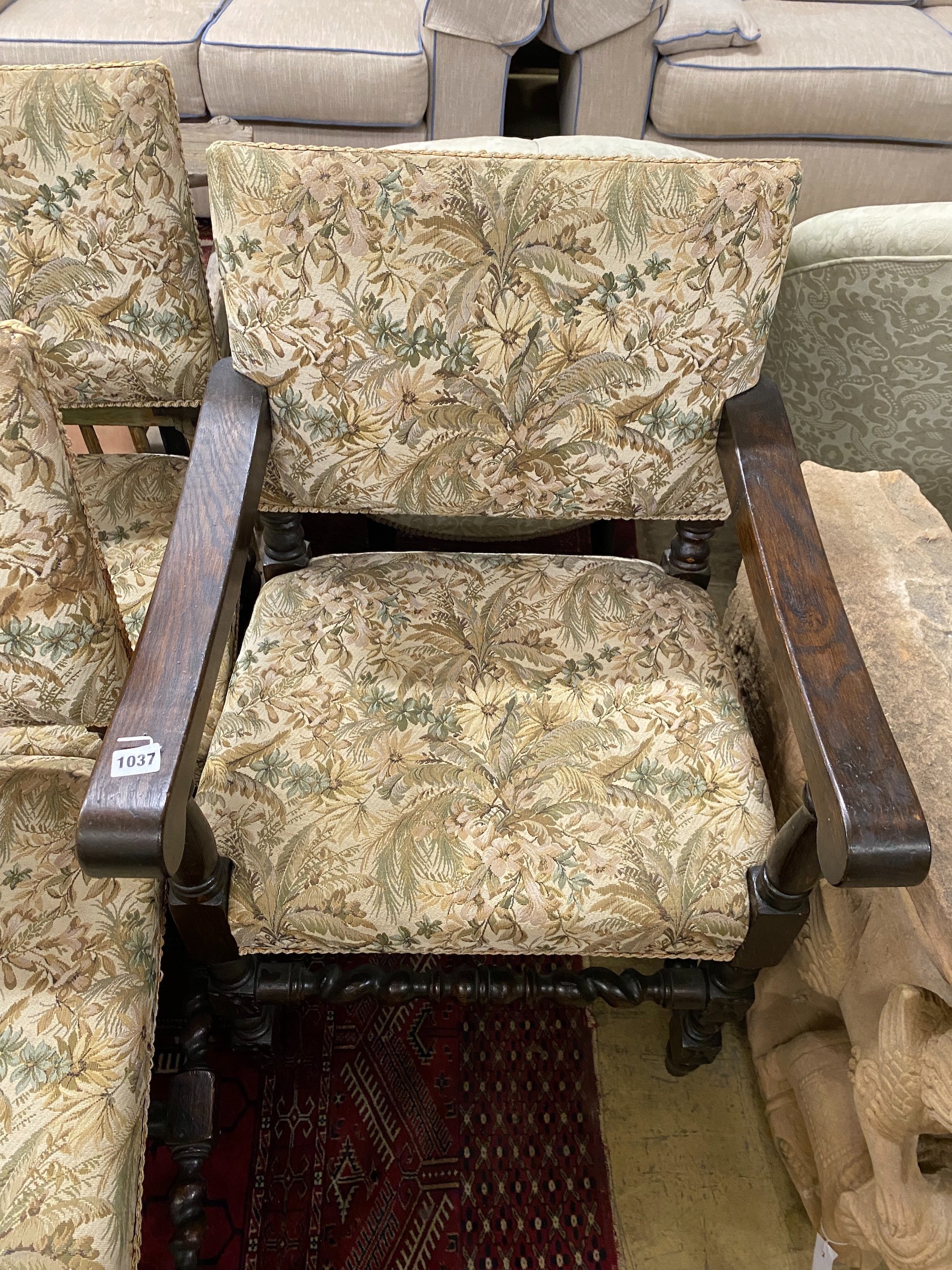 A set of seven 18th century style oak dining chairs, two with arms